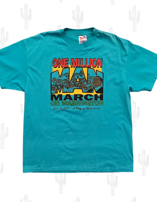 Front image of vintage teal tshirt one million man march on washington 1995 on white background.