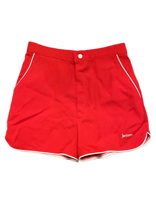 Front of vintage red shorts with white stripe on white background.