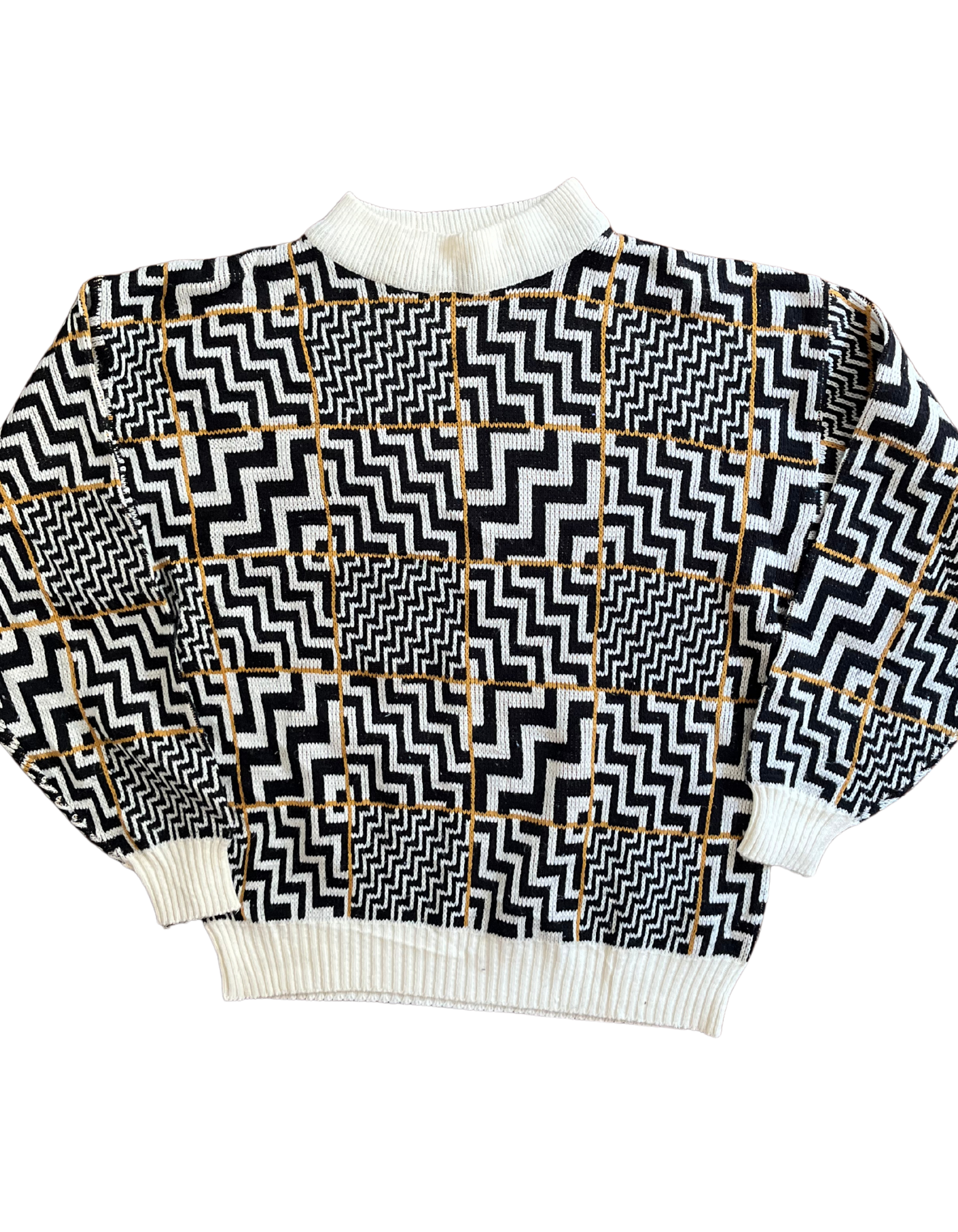 Front image of black and white zig zag sweater on white background.