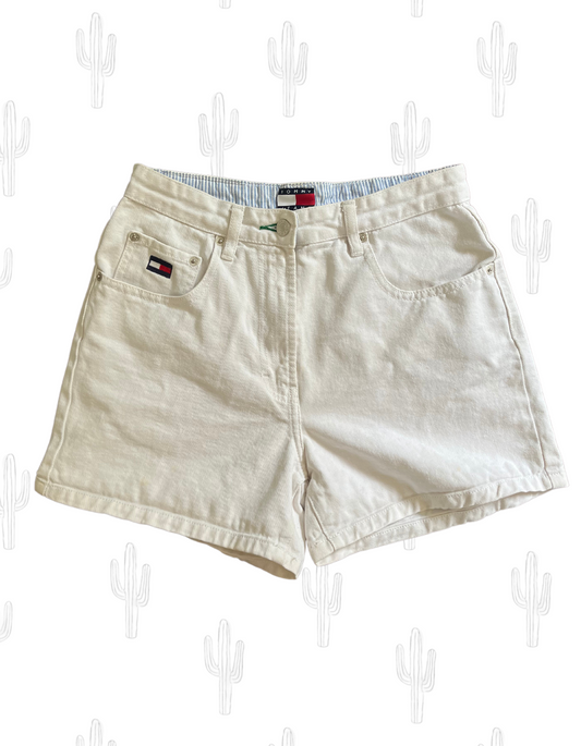 Front image of white denim Tommy Hilfiger shorts on light background.