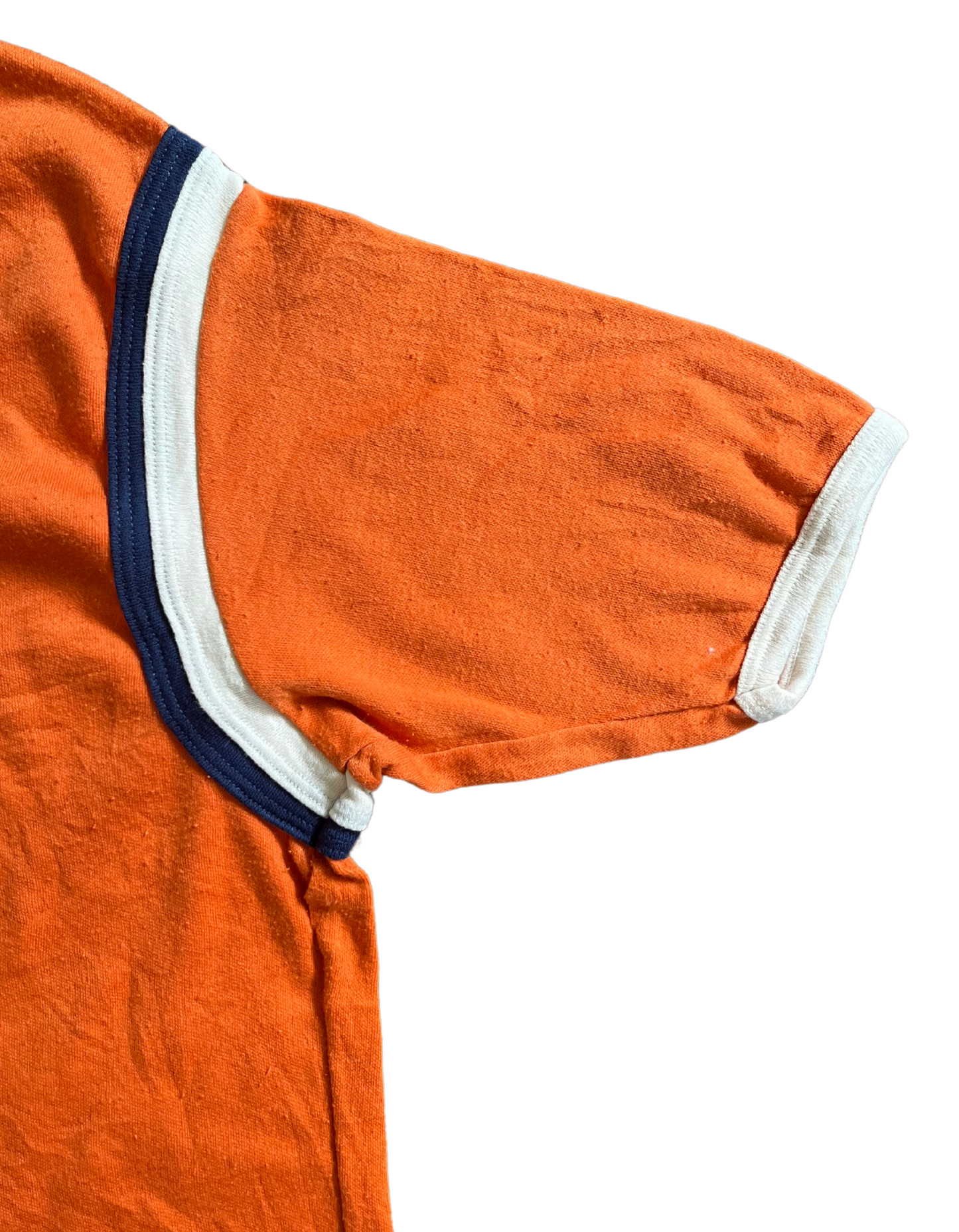 Sleeve image of orange men's ringer tee with navy and white piping on light background.