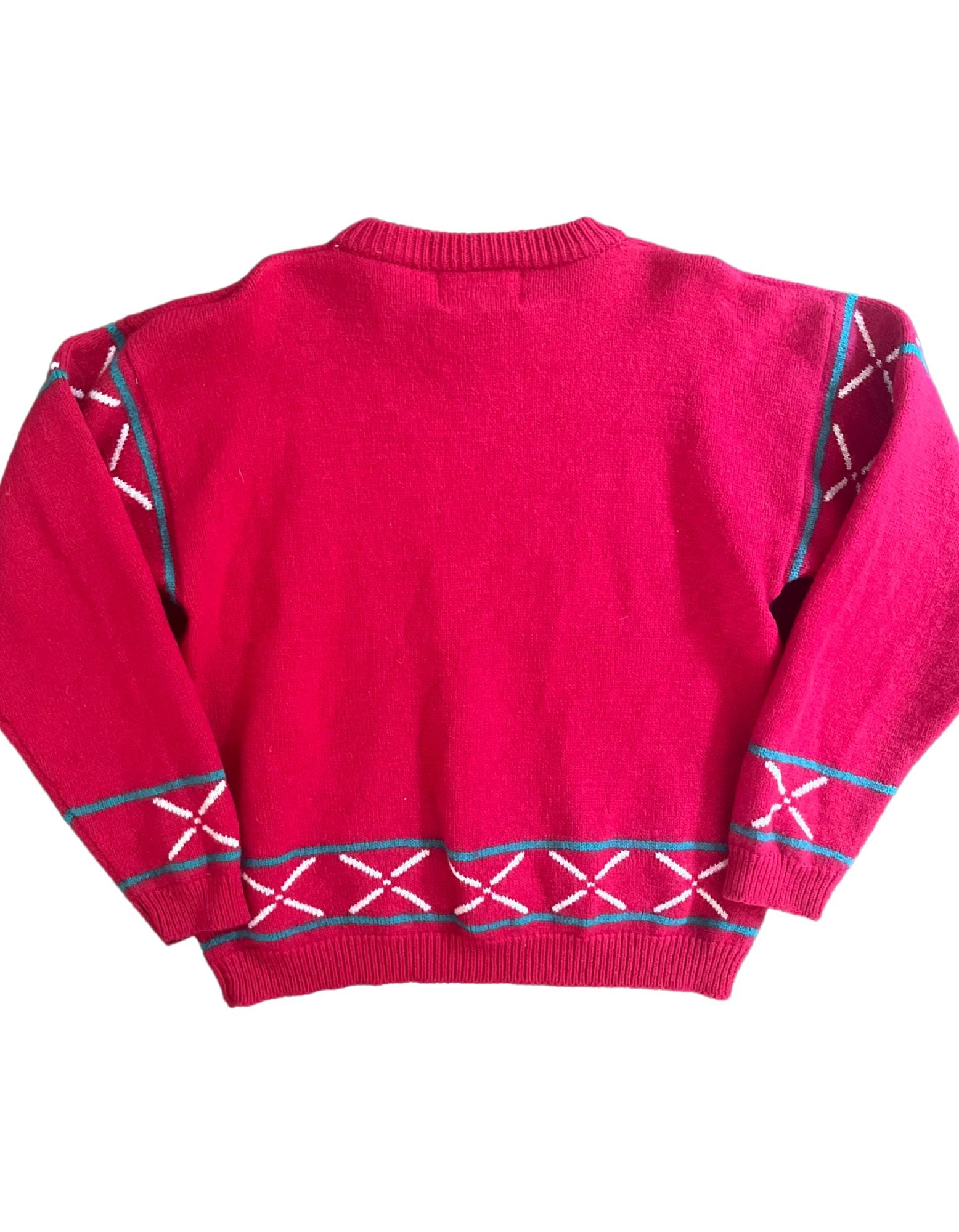 Back image of red sweater with teal, white and blue tribal print design on white background.