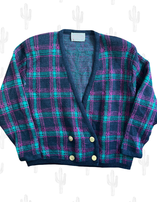 front image of vintage plaid pendelton wool knit cardigan with gold buttons and shoulder pads on light background.