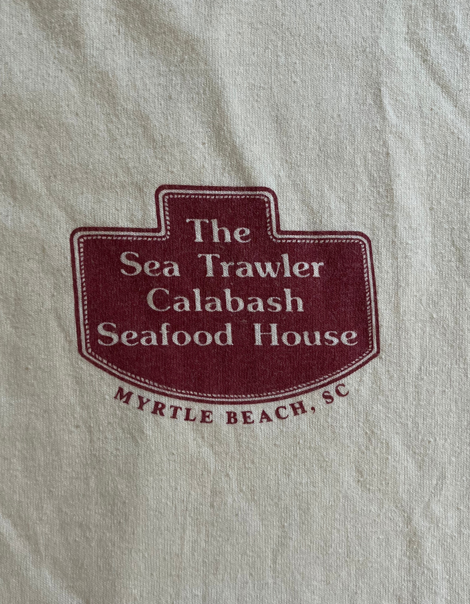 Front image of graphic tee for The SeaTrawler Calabash Seafood House from Myrtle Beach, SC on white background.