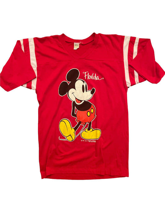 Front image of red Mickey Mouse Florida vneck tee with white rings on sleeves on white background.