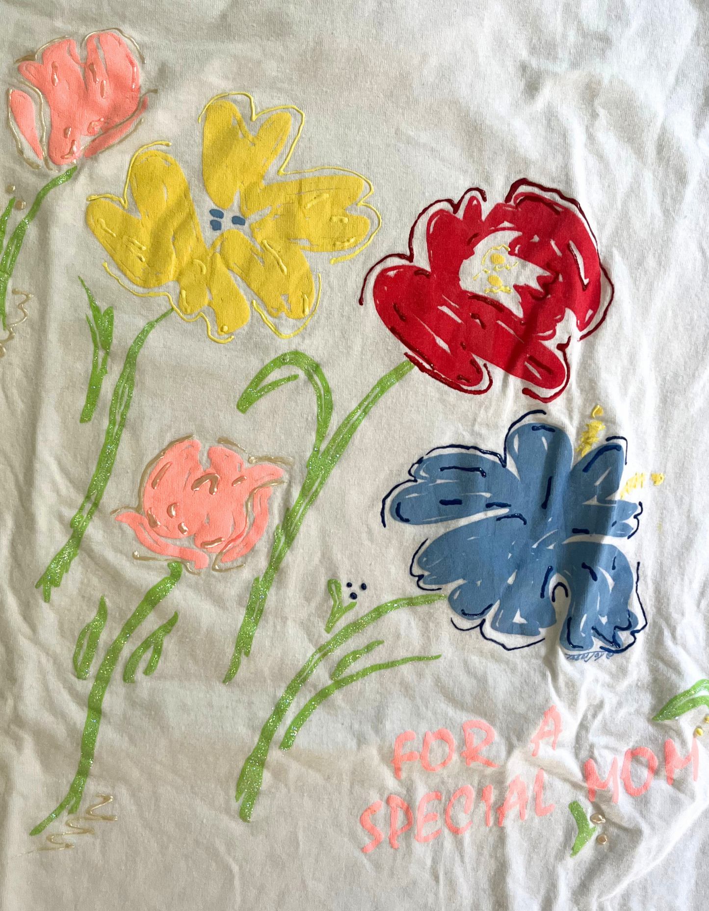 Close up image of xl 'For A Special Mom' tee with flowers on light background.