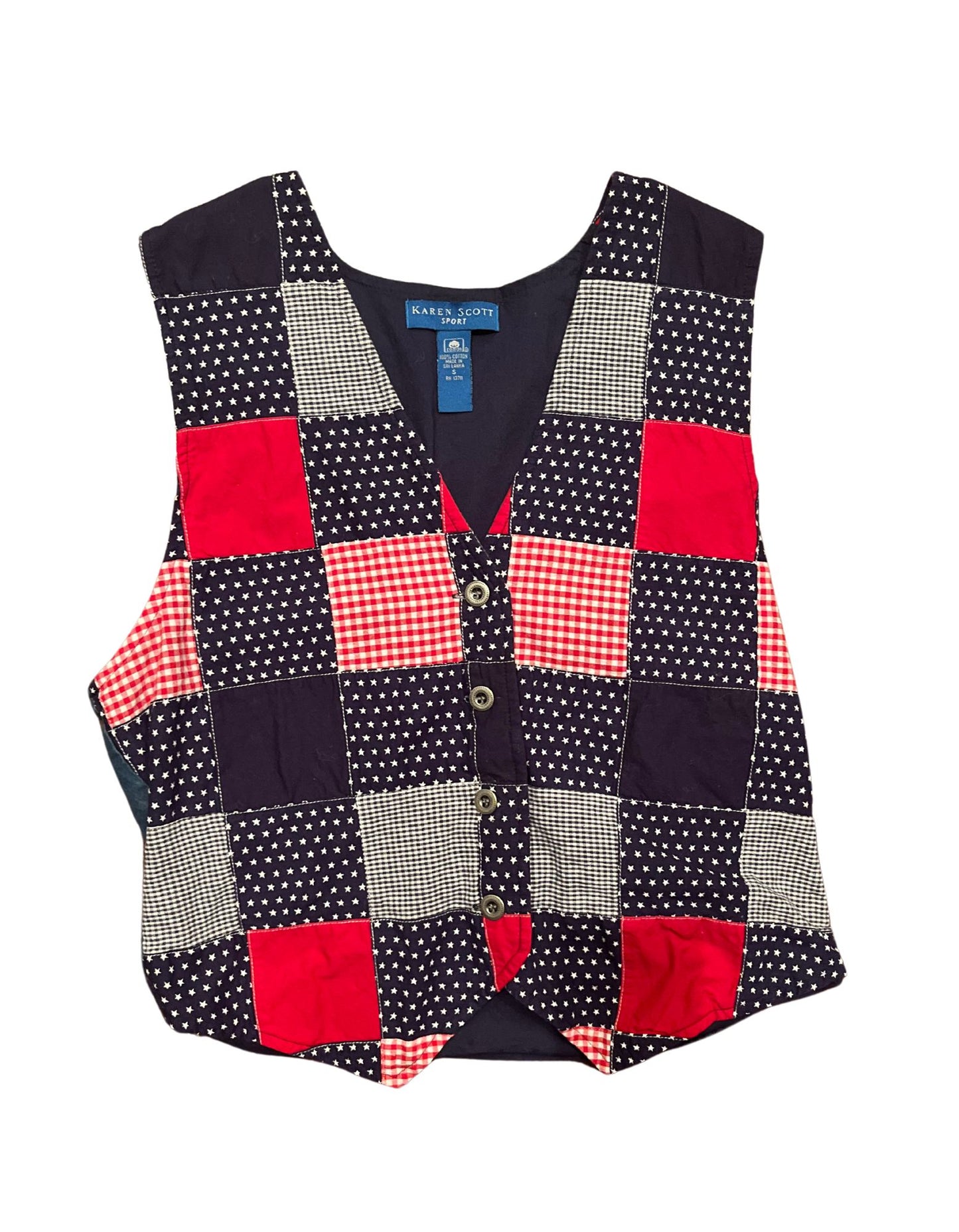 Front image of vintage red, white and blue Karen Scott vest with silver buttons on white background.