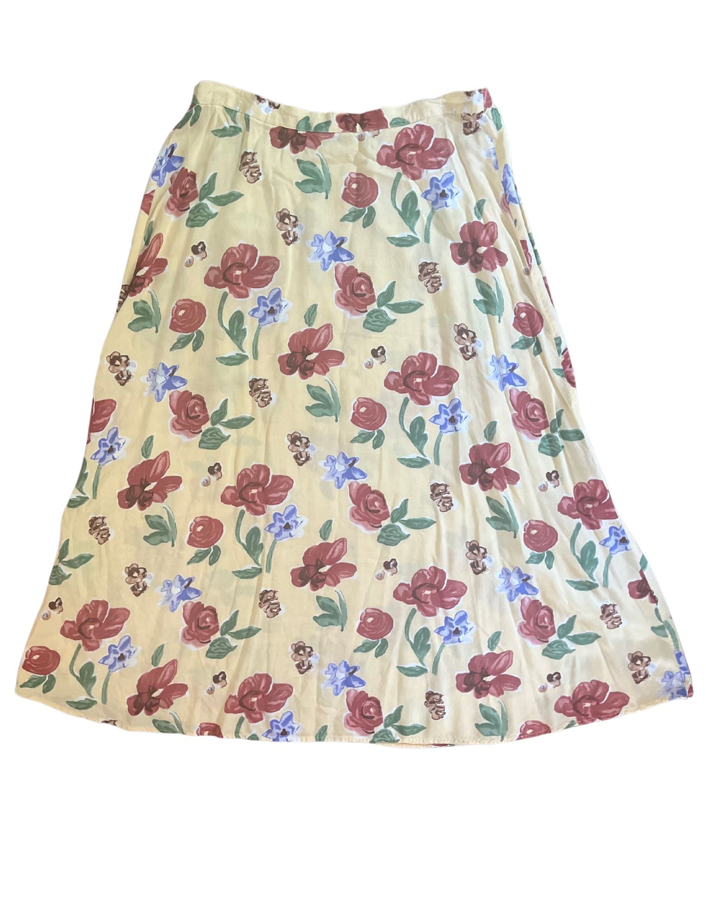 Front image of yellow floral pale yellow skirt with elastic waistband on white backgrouhd.