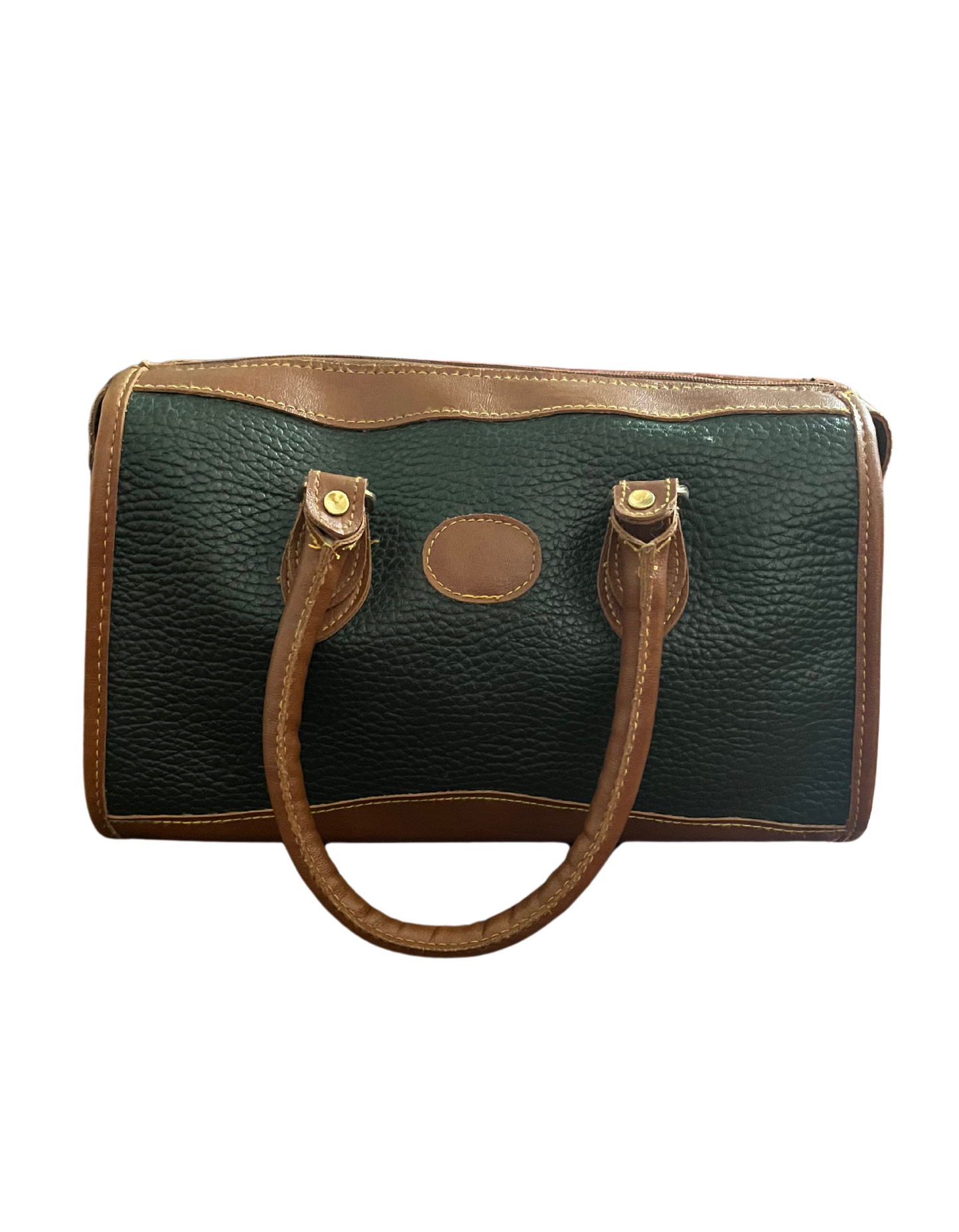 Front image of green and tan shoulder bag on white background.